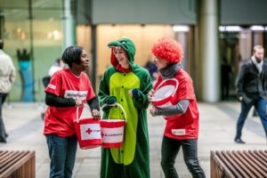 British Red Cross staff collecting money in buckets